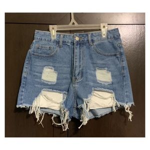 Brand new. Never worn. Blue distressed jean shorts from Shein.